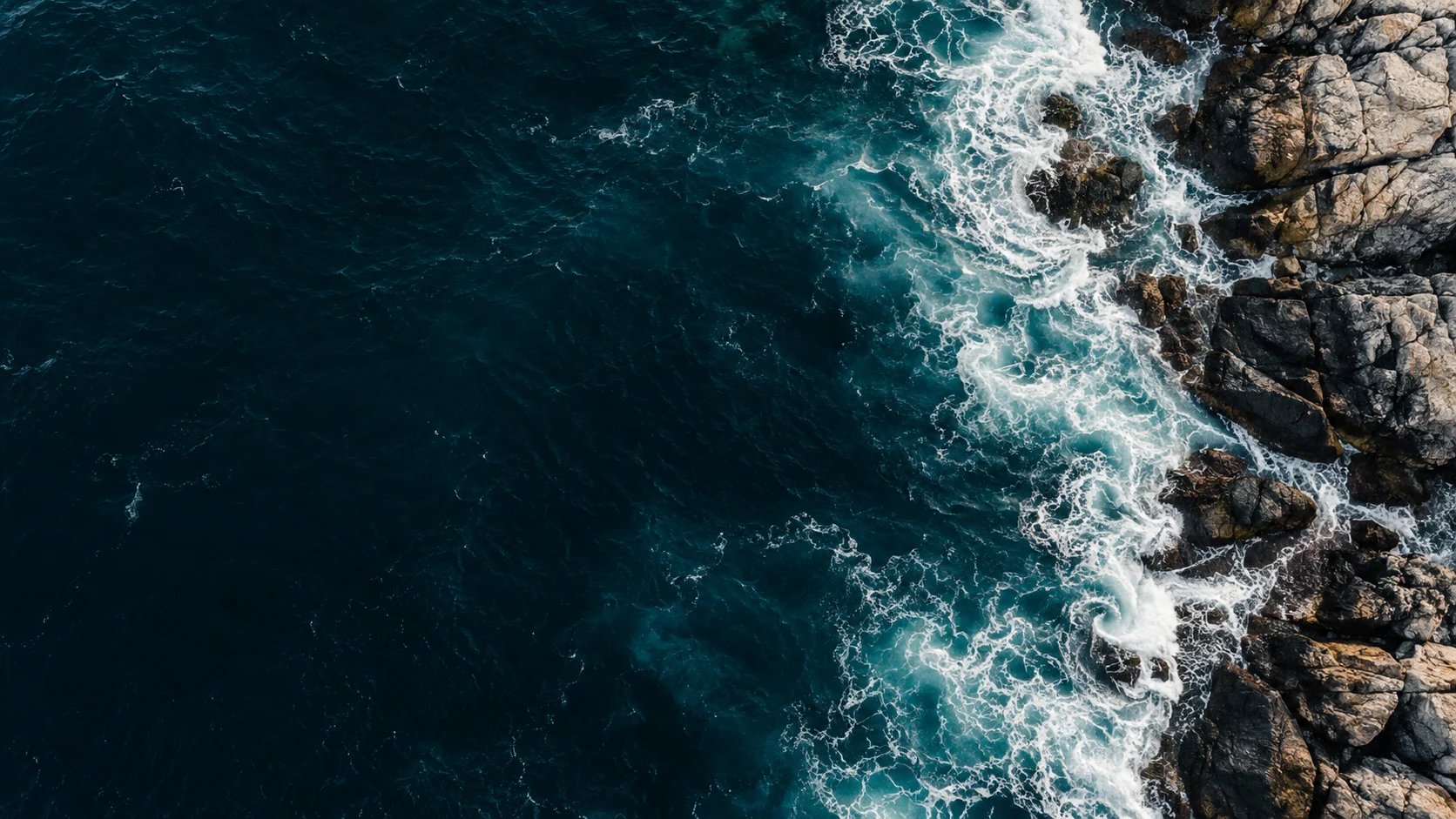 Atlantic waves meeting a rocky coastline